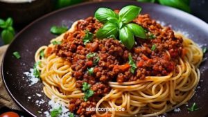 Sauce Bolognese Tauche ein in den Geschmack Italiens - Spaghetti Bolognese - entdecke das Geheimnis hinter einer authentischen Spaghetti Bolognese und lerne, wie du die perfekte Bolognese-Sauce zubereitest. Genieße den Duft von frischen Zutaten, das Aroma von Kräutern und das herzhafte Hackfleisch, das auf al dente gekochten Spaghetti tanzt. Hol dir das Stück Italien in deine Küche und verwöhne dich mit einem Klassiker, der immer wieder begeistert. Mach dich bereit für eine Geschmacksexplosion!